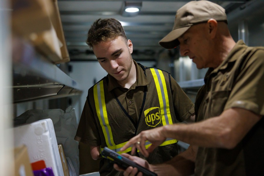 UPS workers delivering packages. (United Parcel Service)