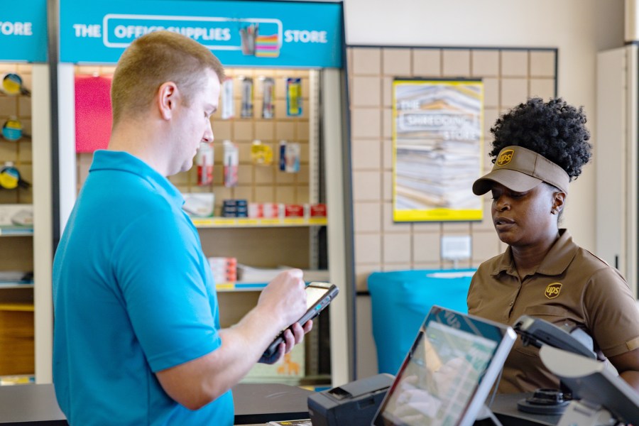 UPS workers at a store. (United Parcel Service)