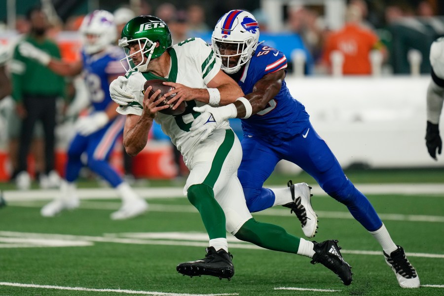 New York Jets quarterback Aaron Rodgers (8) is sacked by Buffalo Bills defensive end Leonard Floyd (56) during the first quarter of an NFL football game, Monday, Sept. 11, 2023, in East Rutherford, N.J. (AP Photo/Seth Wenig)