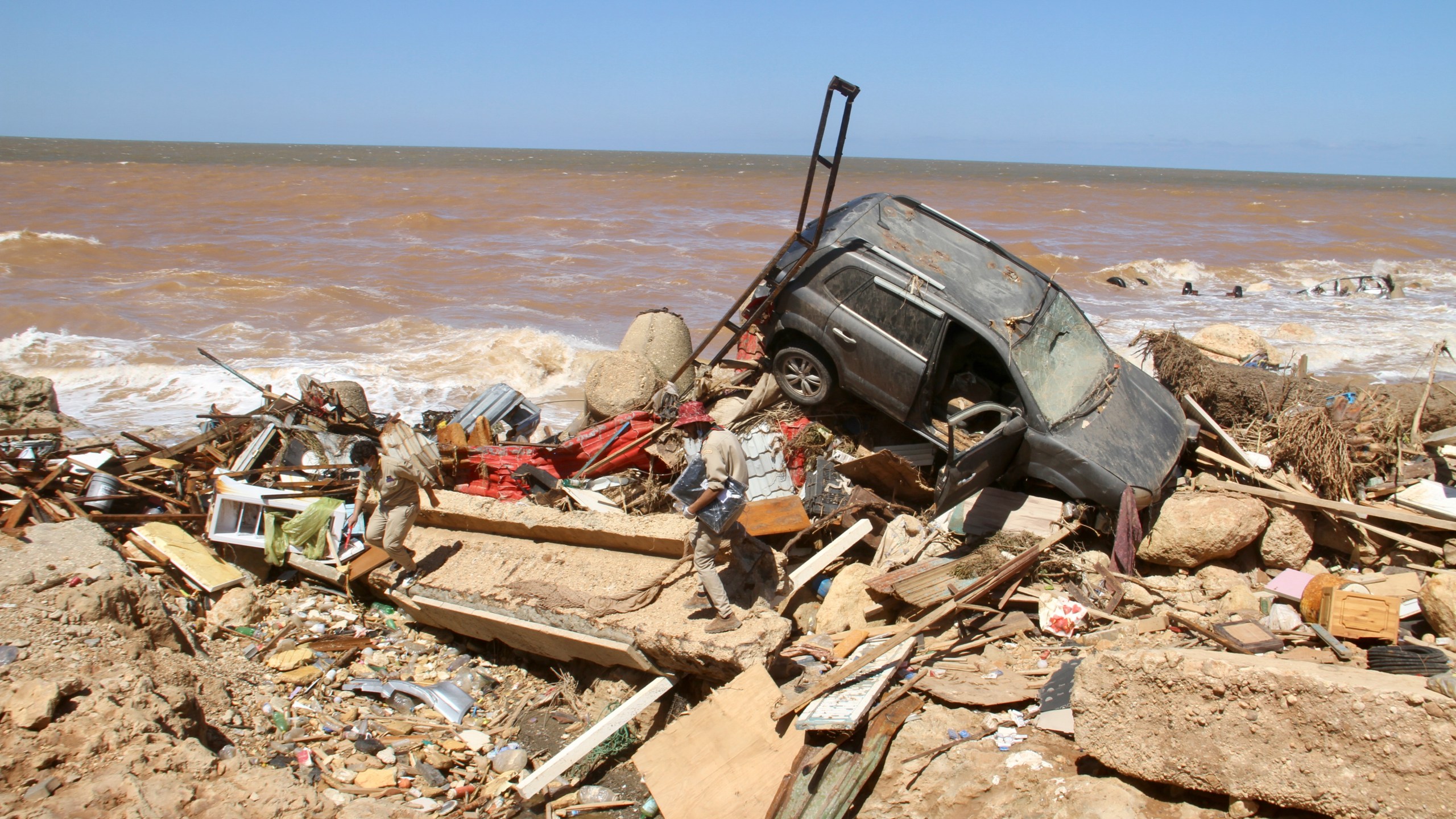 Damage from massive flooding is seen in Derna, Libya, Wednesday, Sept.13, 2023. Search teams are combing streets, wrecked buildings, and even the sea to look for bodies in Derna, where the collapse of two dams unleashed a massive flash flood that killed thousands of people. (AP Photo/Yousef Murad)