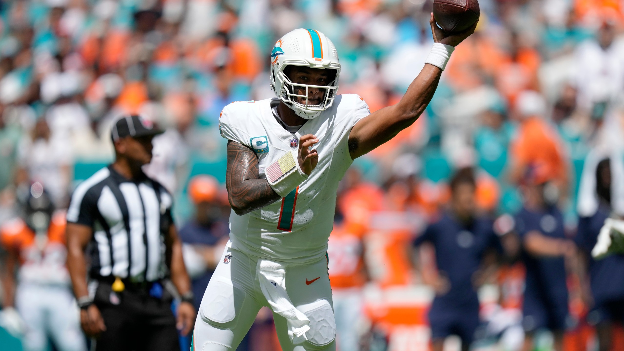 Miami Dolphins quarterback Tua Tagovailoa (1) aims a pass during the first half of an NFL football game against the Denver Broncos, Sunday, Sept. 24, 2023, in Miami Gardens, Fla. (AP Photo/Rebecca Blackwell)