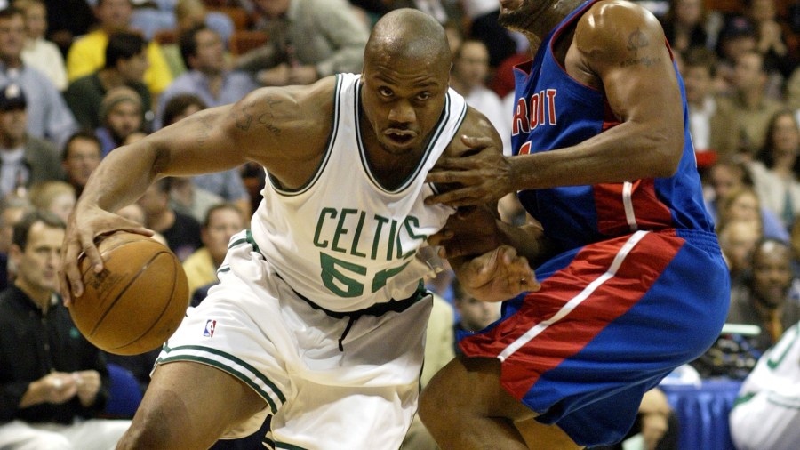 Boston Celtics' Brandon Hunter, left, drives the baseline around the defense of Detriot Pistons' Corliss Williamson in first half preseason action at the the Mohegan Sun Arena in Uncallville, Conn., Wednesday, Oct. 8, 2003. (AP Photo/John Spivey)