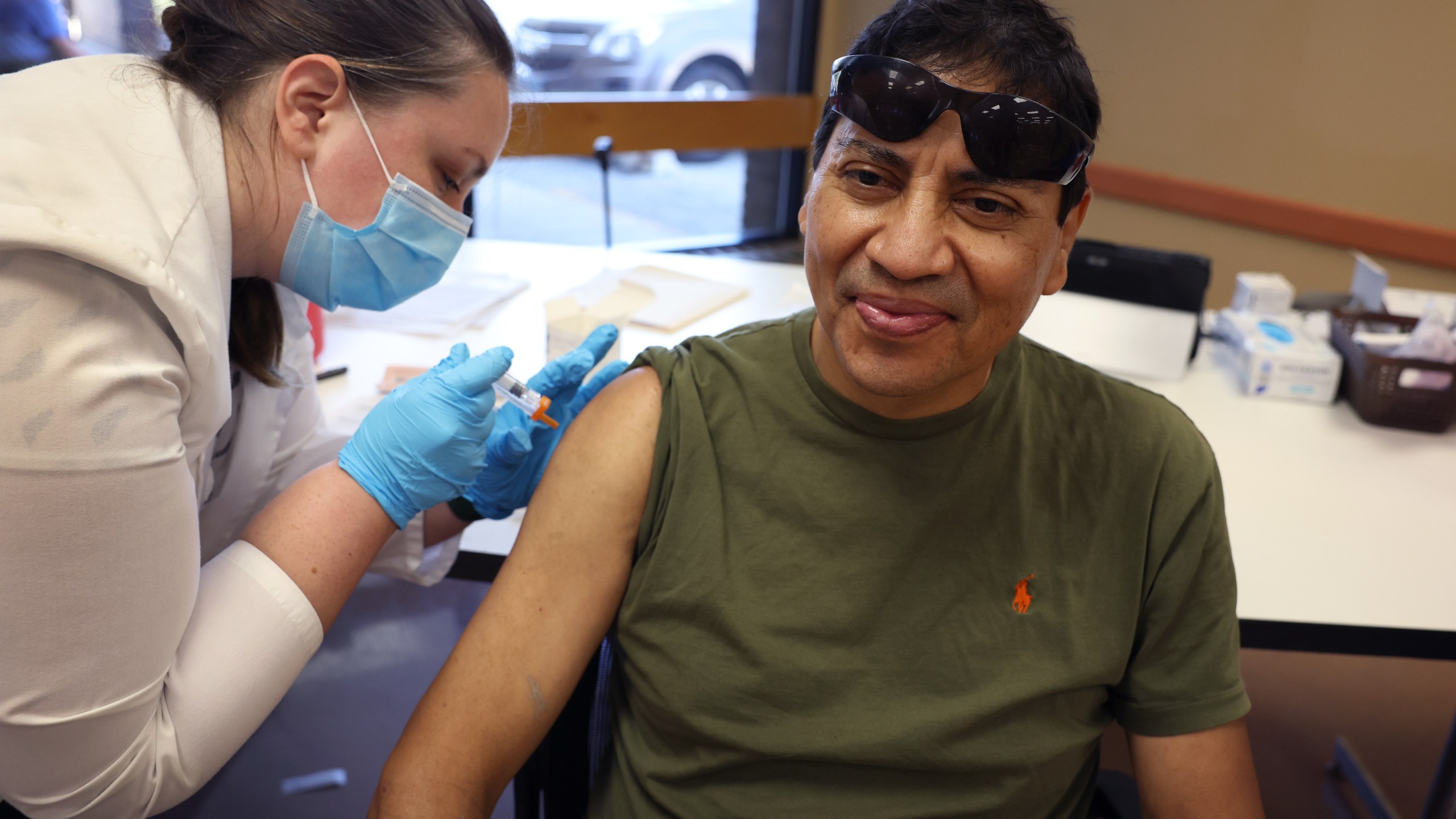 Gustavo Perez gets an influenza vaccine from pharmacist Patricia Pernal during an event hosted by the Chicago Department of Public Health at the Southwest Senior Center on Sept. 9, 2022, in Chicago, Illinois. (Scott Olson/Getty Images)