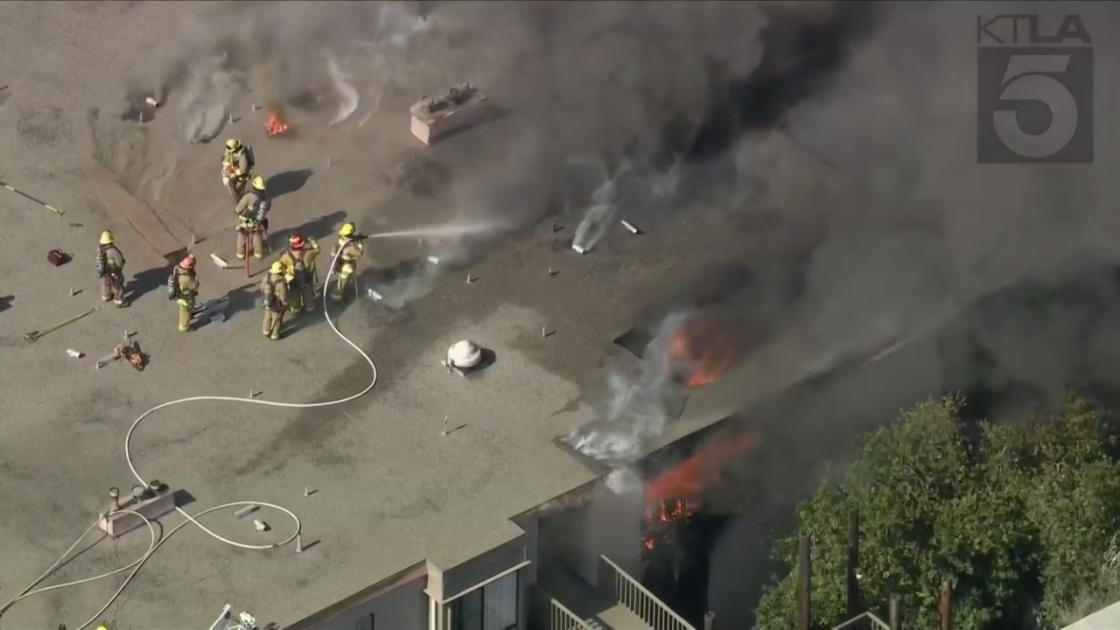 Firefighters battle a house blaze in Marina del Rey on Sept. 14,