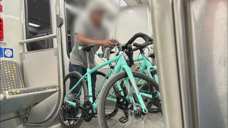 Two men seen carrying several bikes with price tags from Irwindale Cycles on the same morning of the theft on Aug. 28, 2023. (Christel Sayegh)