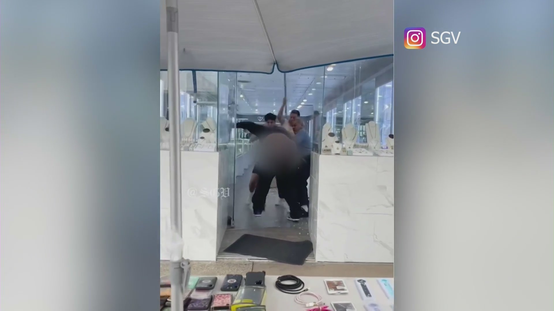 Video: employees fight back against robbery suspect who sprayed them with bear repellent