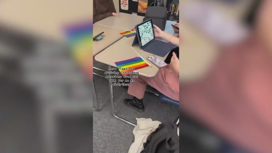 Pride flags being handed out by Moxxie, a 16-year-old high school student in Temecula, to his classmates in protest of the school district’s flag ban policy. (Moxxie)