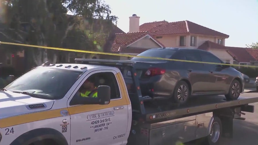 Kevin Salazar’s vehicle being towed on Sept. 18, 2023 from his Palmdale home, believed to be involved in the killing of L.A. County Sheriff’s Deputy Ryan Clinkunbroomer. (KTLA)