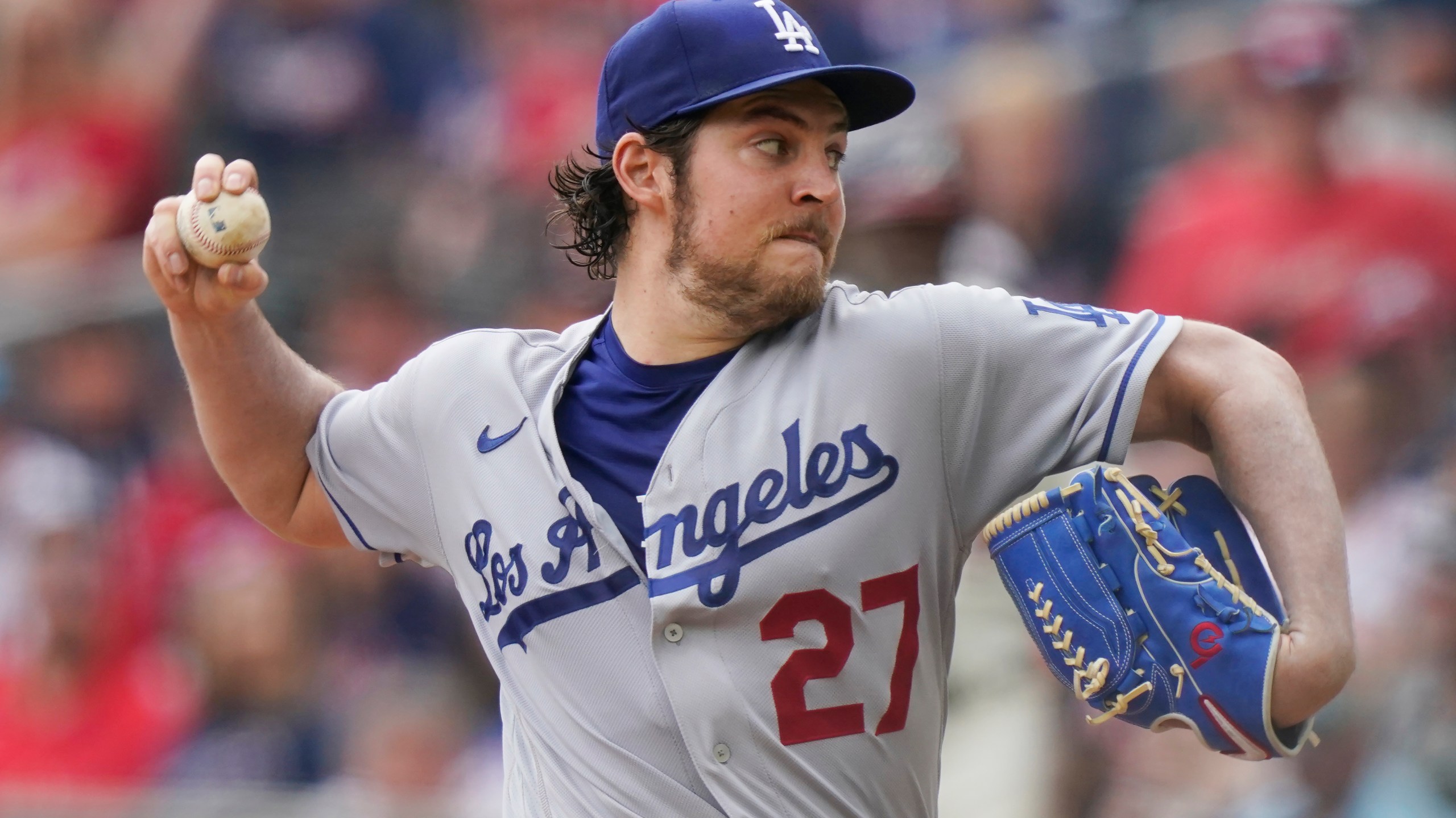 FILE - Los Angeles Dodgers starting pitcher Trevor Bauer (27) delivers in the first inning of a baseball game against the Atlanta Braves Sunday, June 6, 2021, in Atlanta. Former major league pitcher Trevor Bauer and a woman who accused him of beating and sexually assaulting her in 2021 have settled their legal dispute, Bauer's attorneys said Monday, Oct. 2, 2023. (AP Photo/Brynn Anderson, File)