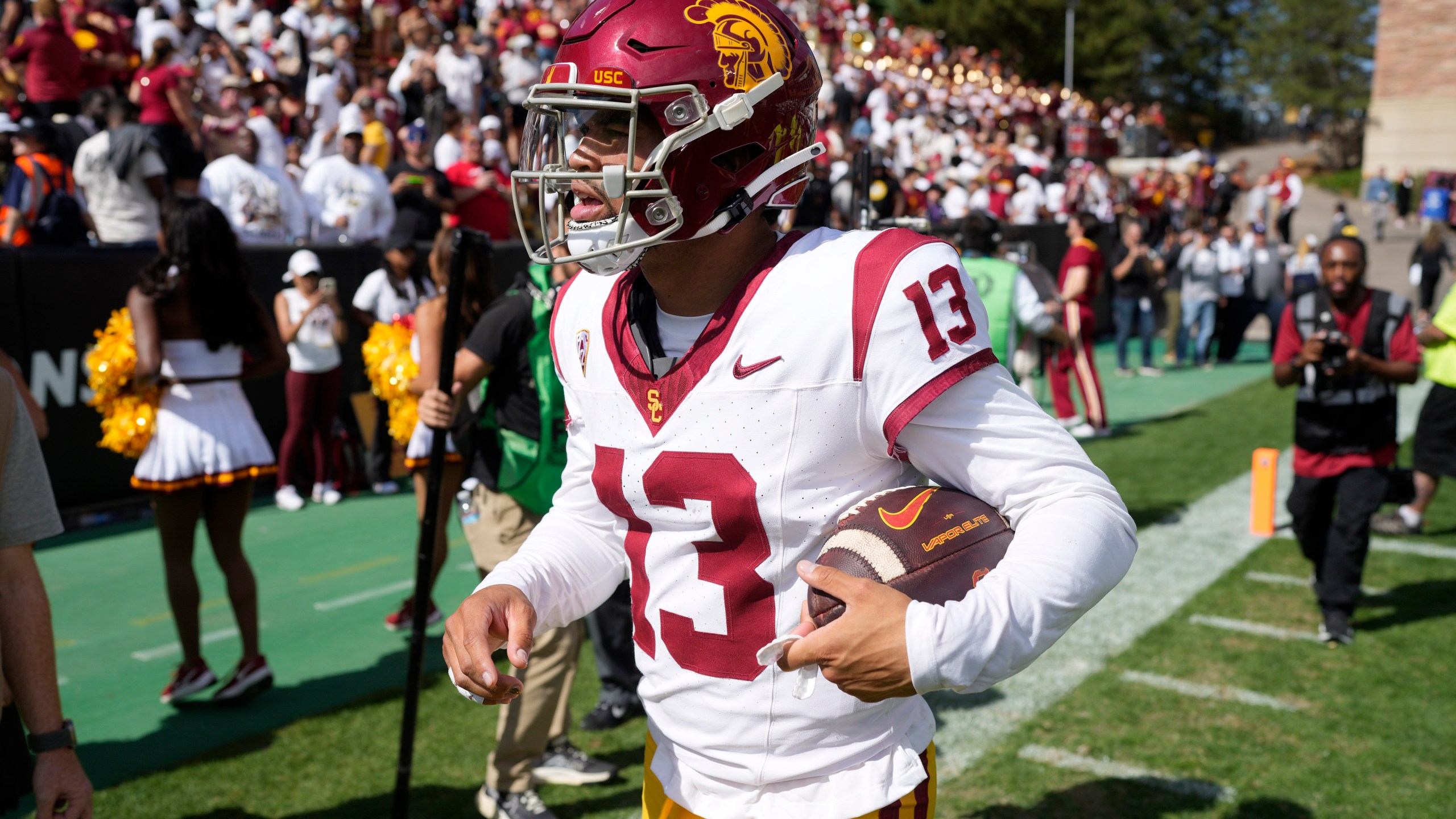 Southern California quarterback Caleb Williams surveys the crowd as he heads off the field after an NCAA college football game against the Colorado Saturday, Sept. 30, 2023, in Boulder, Colo. (AP Photo/David Zalubowski)