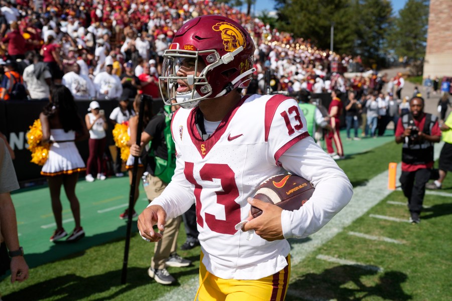 Southern California quarterback Caleb Williams surveys the crowd as he heads off the field after an NCAA college football game against the Colorado Saturday, Sept. 30, 2023, in Boulder, Colo. (AP Photo/David Zalubowski)