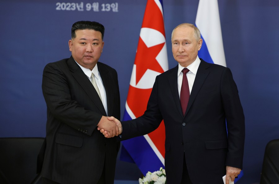 Russian President Vladimir Putin, right, and North Korea's leader Kim Jong Un shake hands during their meeting at the Vostochny cosmodrome outside the city of Tsiolkovsky, about 200 kilometers (125 miles) from the city of Blagoveshchensk in the far eastern Amur region, Russia, on Sept. 13, 2023. (Vladimir Smirnov, Sputnik, Kremlin Pool Photo via AP, File)