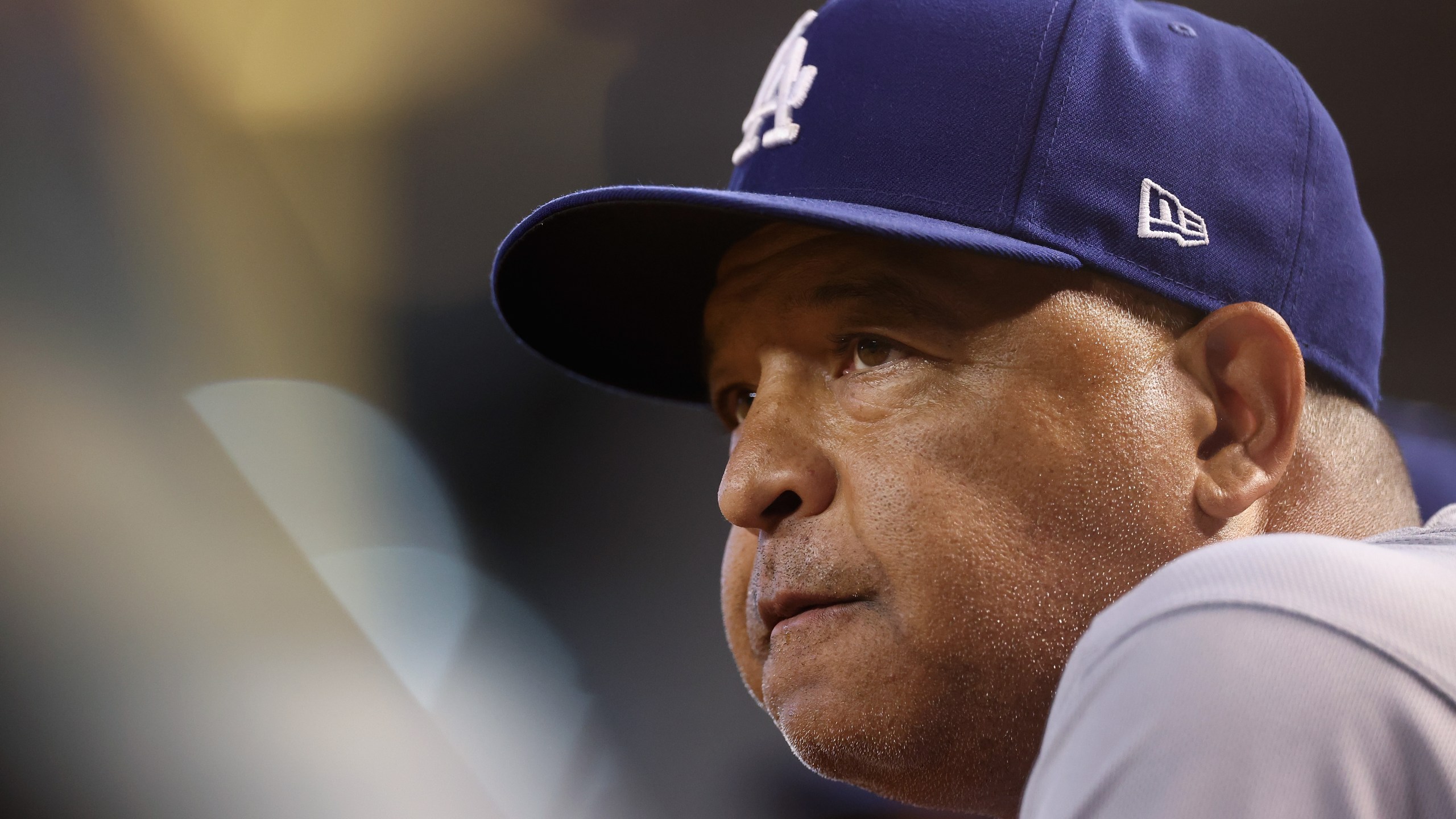 Manager Dave Roberts of the Los Angeles Dodgers watches from the dugout during the fourth inning of the MLB game against the Arizona Diamondbacks at Chase Field on August 08, 2023 in Phoenix, Arizona. (Getty Images)