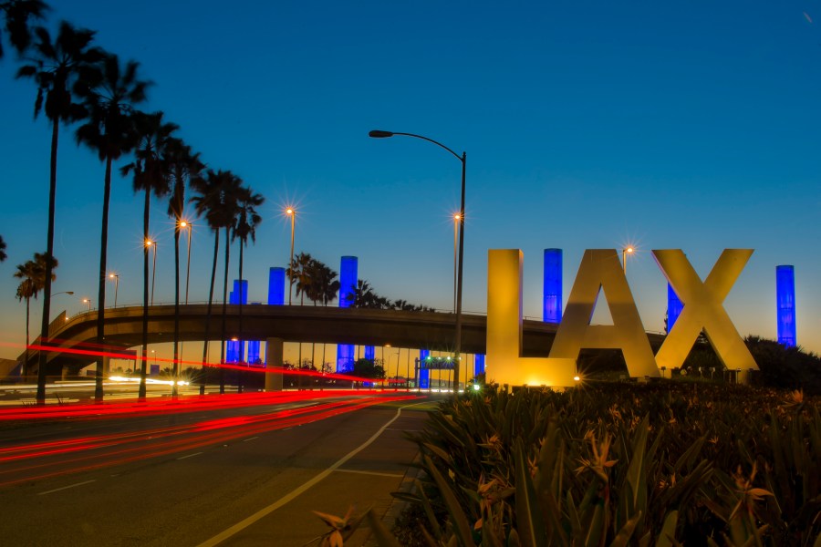 Long exposure of the iconic LAX Los Angeles International Airport sign at night. (Getty Images)