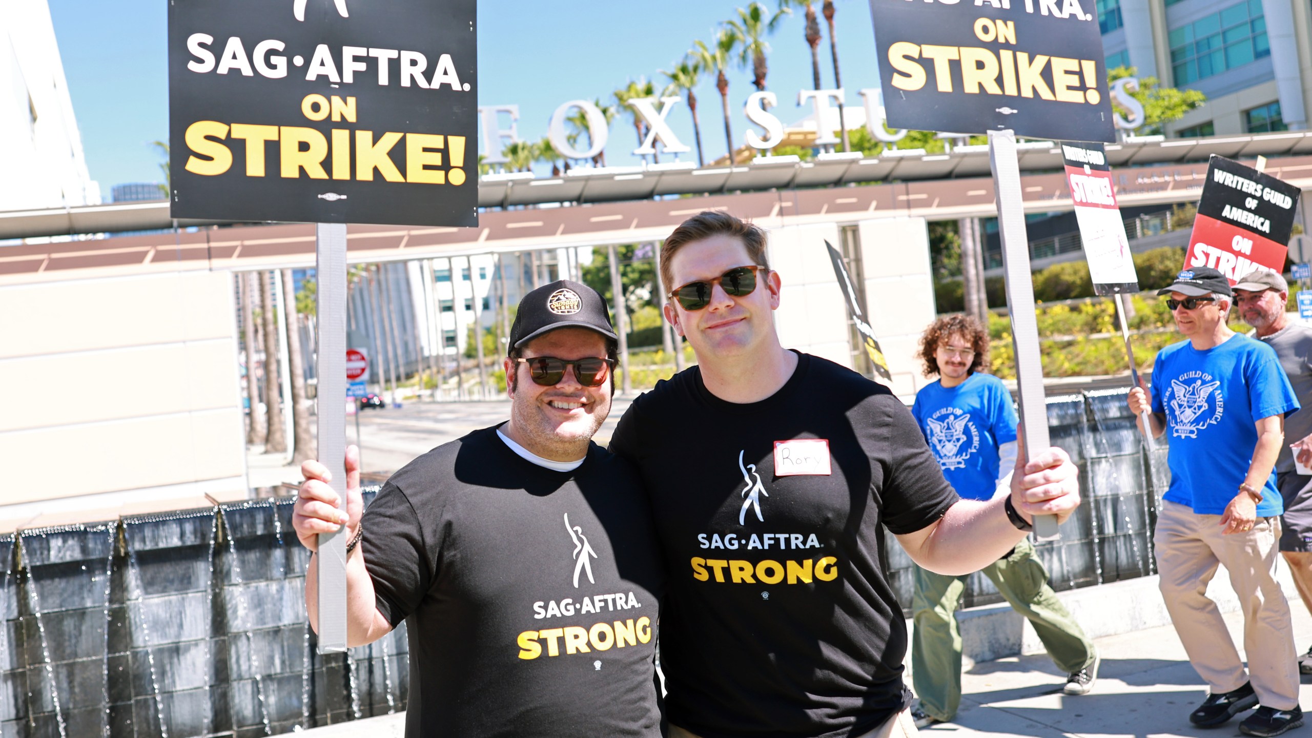 Josh Gad and Rory O'Malley join SAG-AFTRA and WGA members as they walk the picket line outside Fox Studios on July 14, 2023 in Los Angeles, California. (Matt Winkelmeyer/Getty Images)