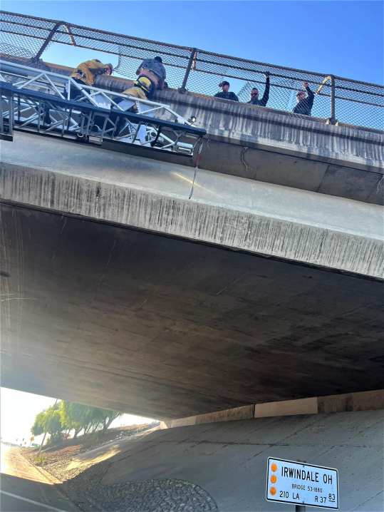 Officers rescued a man threatening to jump off an overpass on the 210 Freeway in Irwindale on Oct. 5, 2023. (Irwindale Police Department)