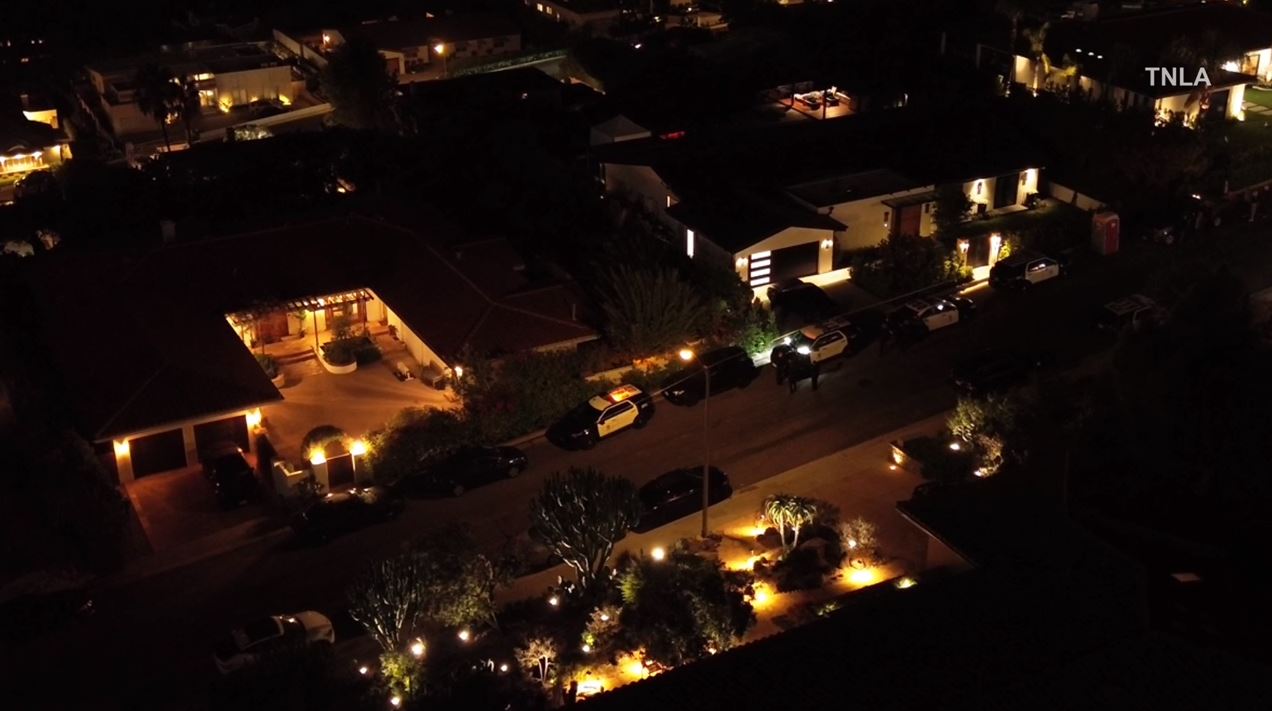 Law enforcement and loved ones arrive at Matthew Perry's Pacific Palisades home following news of the actor's death on Oct. 28, 2023. (TNLA)