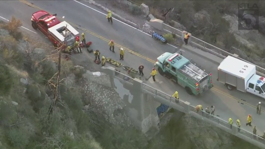 A trapped driver was rescued by crews after crashing off the side of a bridge in the Angeles National Forest on Oct. 6, 2023. (KTLA)