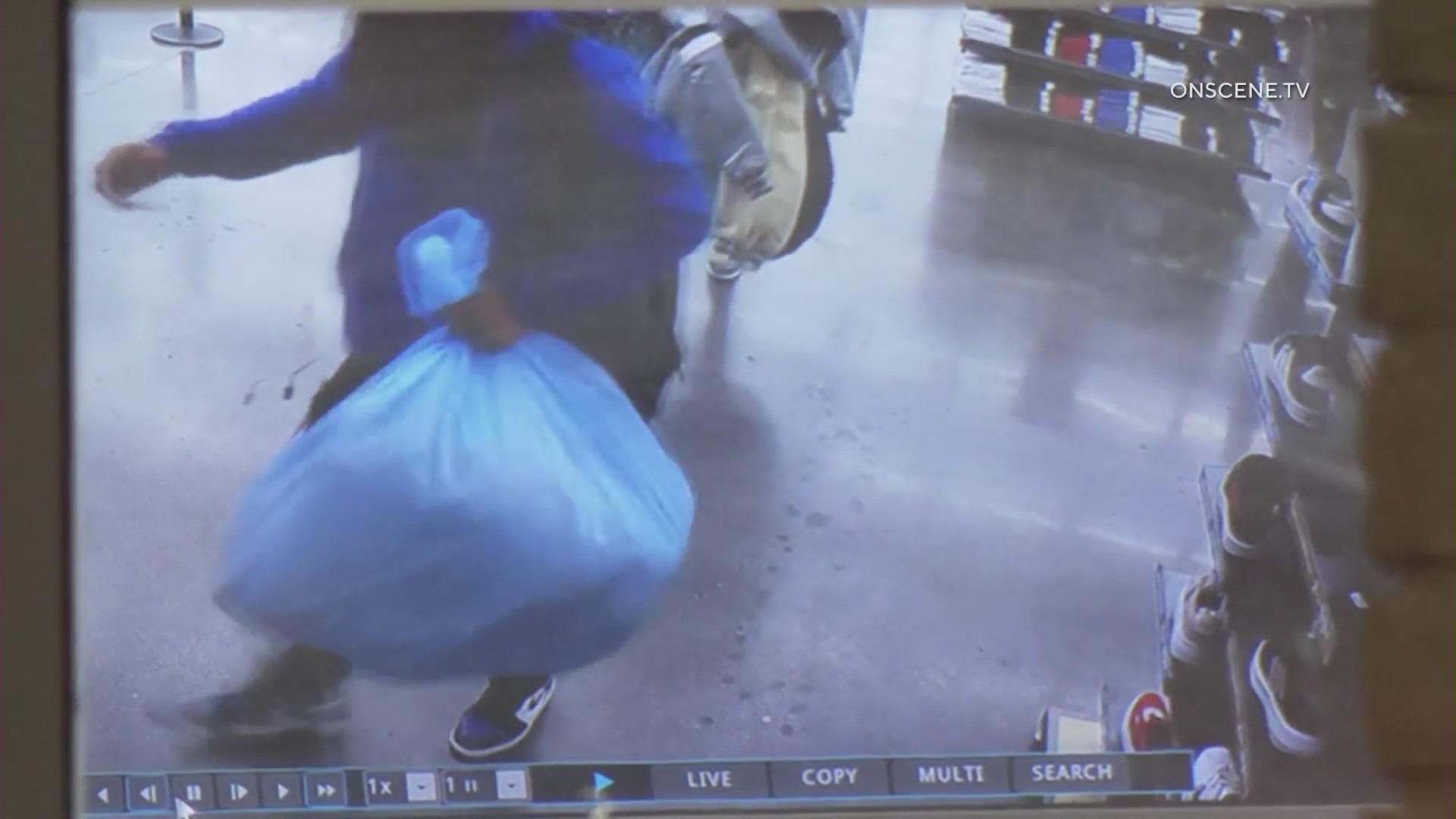 8 suspects caught on camera stealing thousands of dollars in merchandise from shoe store