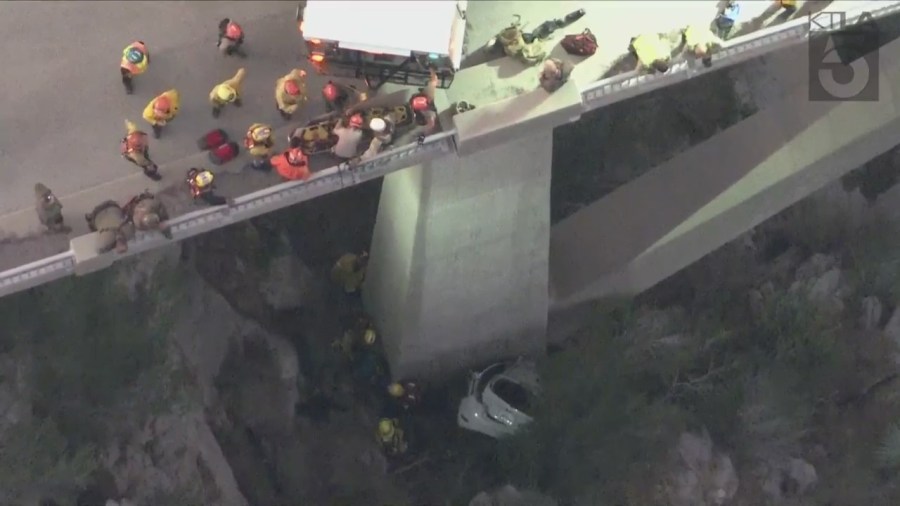 A trapped driver was rescued by crews after crashing off the side of a bridge in the Angeles National Forest on Oct. 6, 2023. (KTLA)