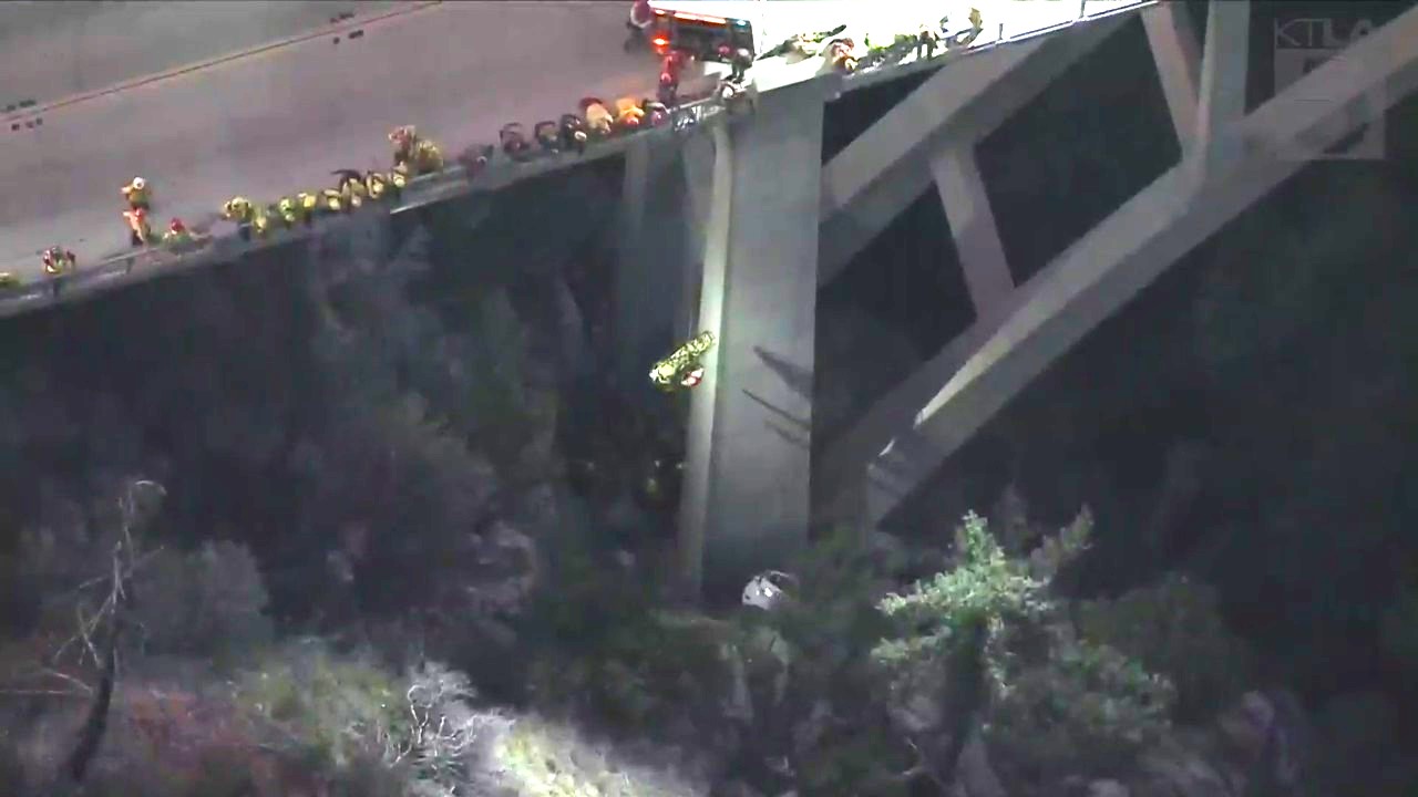 A trapped driver was rescued by crews after crashing off the side of a bridge in the Angeles National Forest on Oct. 6, 2023. (KTLA)