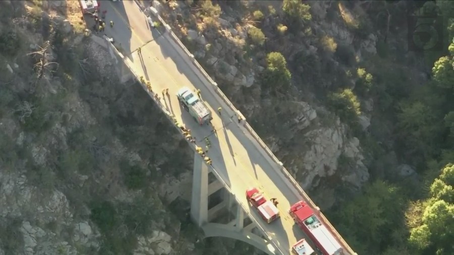 A trapped driver was rescued by crews after crashing off the side of a bridge in the Angeles National Forest on Oct. 6, 2023. (KTLA)