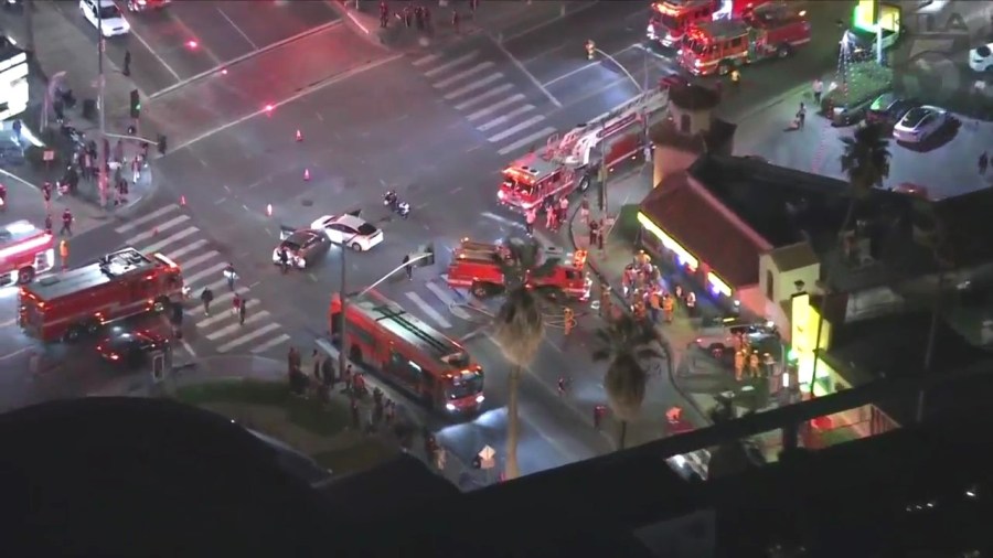 At least one person is hospitalized after a three-vehicle collision sent a truck crashing through a pizza shop in Hollywood on Oct. 31, 2023. (KTLA)