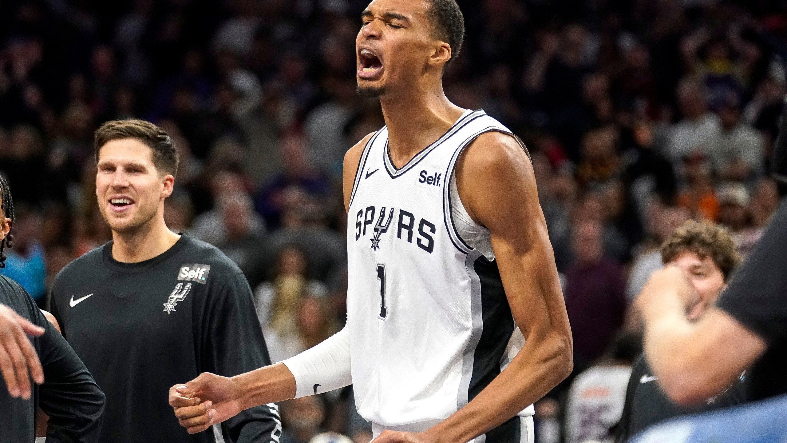 San Antonio Spurs' Victor Wembanyama pumps his fist after the team's win over the Phoenix Suns in an NBA basketball game in Phoenix, Tuesday, Oct. 31, 2023. The Spurs won 115-114. (AP Photo/Darryl Webb)