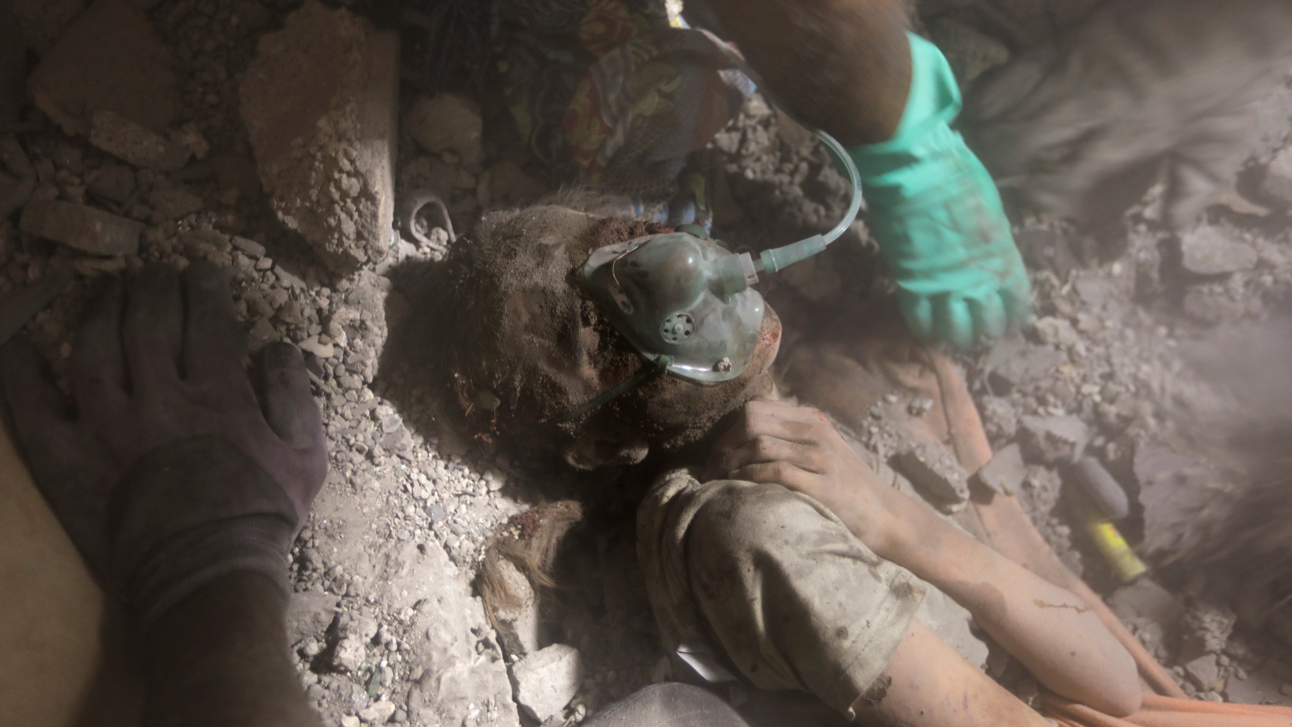 Palestinians rescue a wounded girl from under the rubble of a destroyed building following an Israeli airstrike in Khan Younis refugee camp, southern Gaza Strip, Tuesday, Nov. 7, 2023. (AP Photo/Mohammed Dahman)