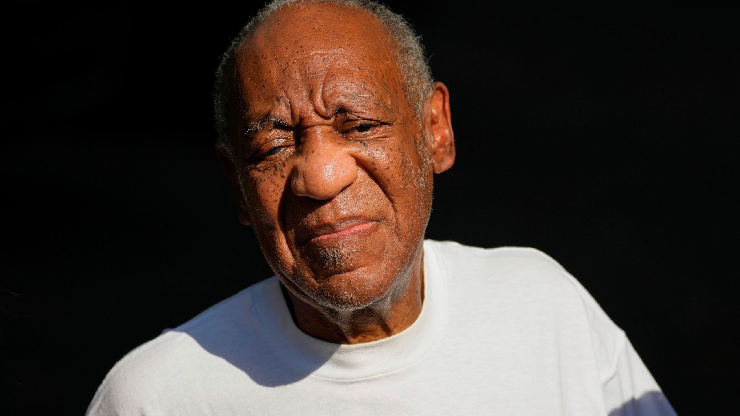 FILE - Bill Cosby reacts outside his home in Elkins Park, Pa., Wednesday, June 30, 2021, after being released from prison. A woman who said Cosby sexually assaulted her when she was a young comedy writer more than 50 years ago filed a lawsuit against the actor Thursday, Nov. 16, 2023, under a soon-to-expire New York law that gave victims of sexual abuse a year to file lawsuits for decades-old allegations. (AP Photo/Matt Slocum, File)