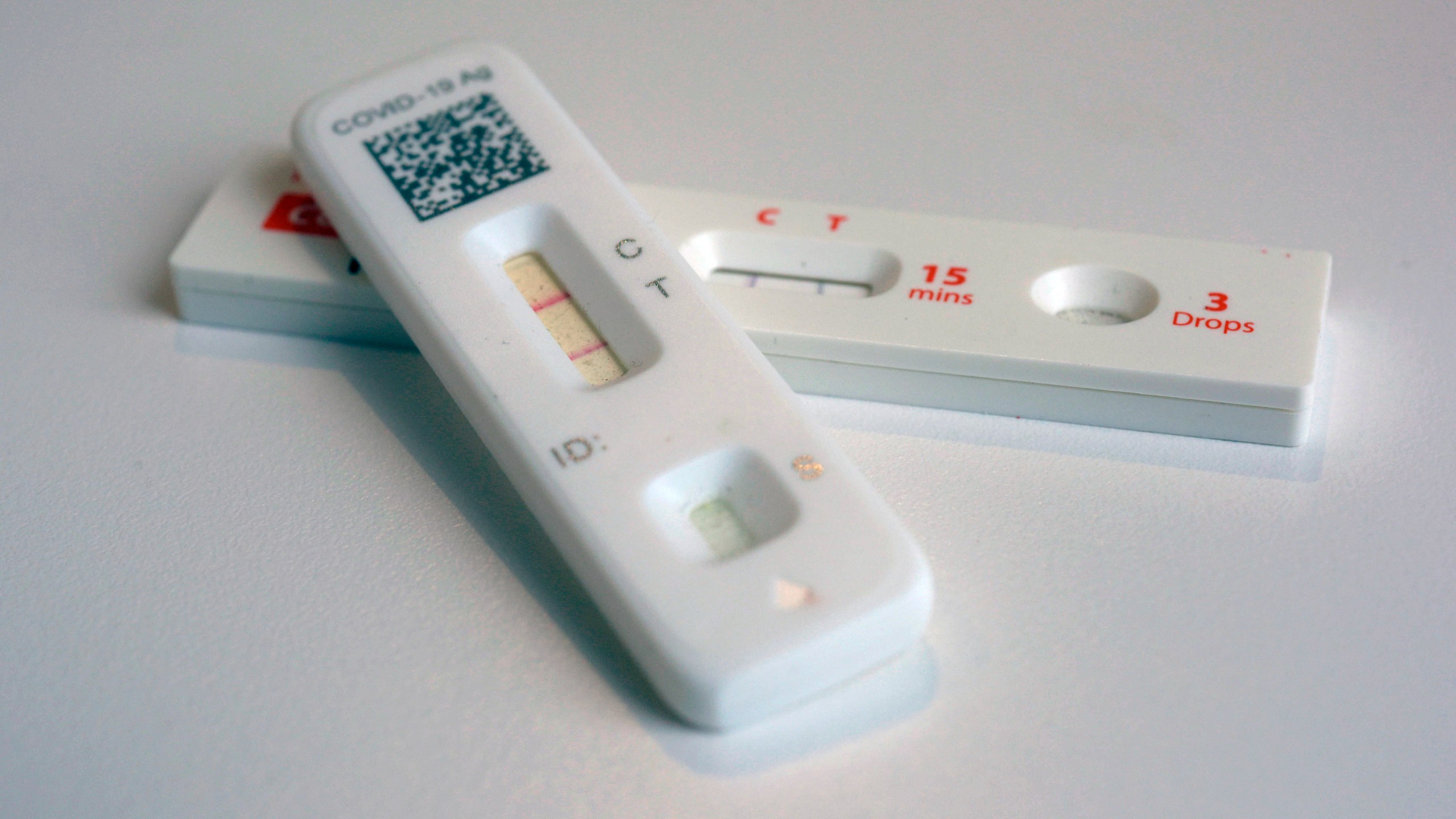 FILE - COVID-19 antigen home tests indicating a positive result are photographed in New York, April 5, 2023. Americans will be able to order four free COVID-19 tests again and the United States Postal Service will deliver the tests to your mailbox. Anyone who did not order a batch of COVID-19 tests in September can secure up to eight of the tests this time around. (AP Photo/Patrick Sison, File)