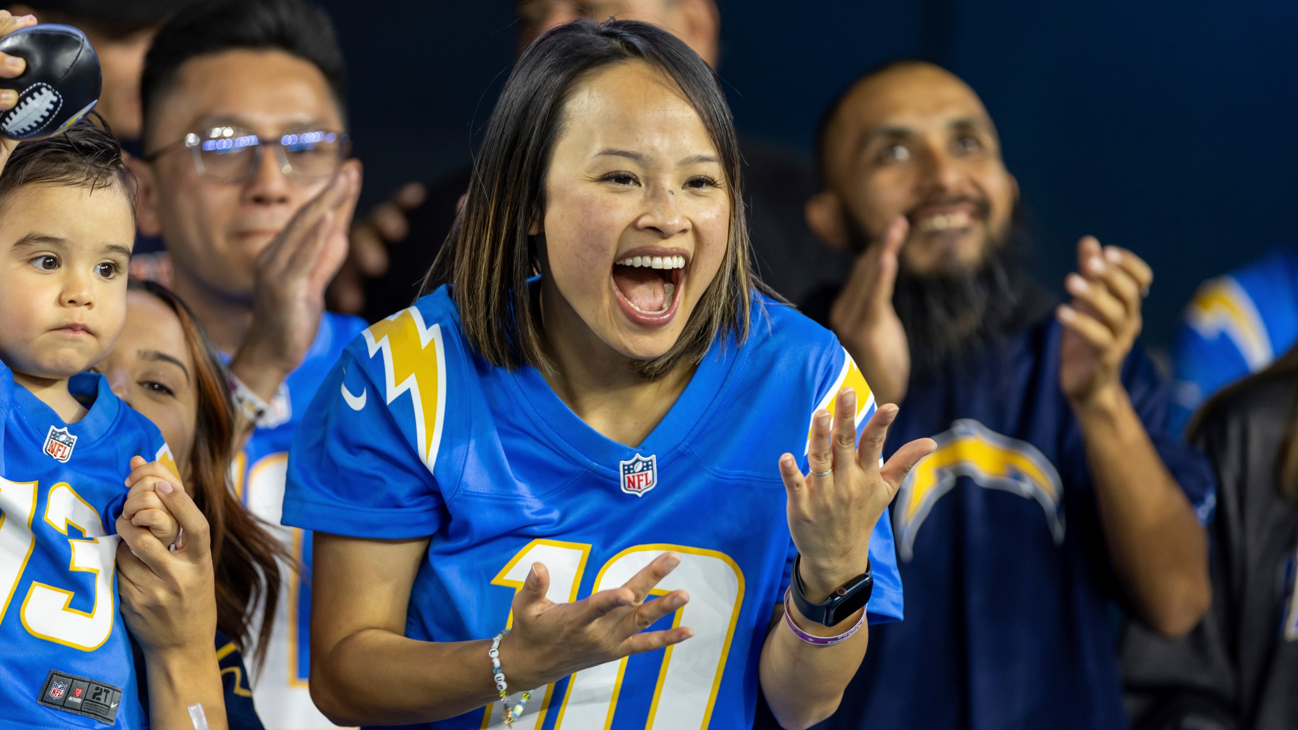 Los Angeles Chargers fan Merianne Do cheers for the Chargers while the Chargers play against the Chicago Bears in an NFL football game, Sunday, Oct. 29, 2023, in Inglewood, Calif. Chargers defeated the Bears 30-13. (AP Photo/Jeff Lewis)
