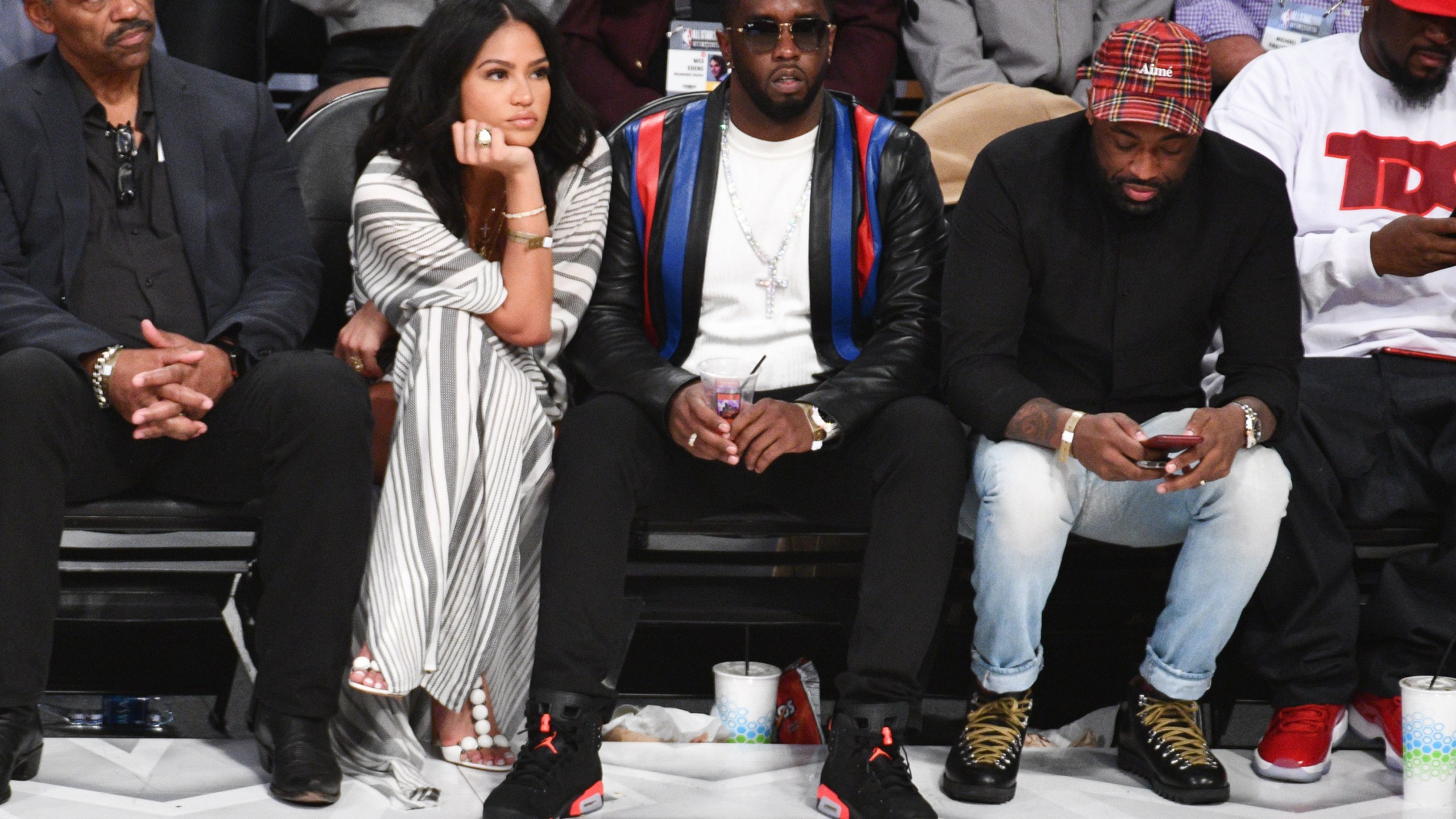 LOS ANGELES, CA - FEBRUARY 18: Sean Combs and dancer Cassie attend The 67th NBA All-Star Game: Team LeBron Vs. Team Stephen at Staples Center on February 18, 2018 in Los Angeles, California. (Photo by Allen Berezovsky/Getty Images)