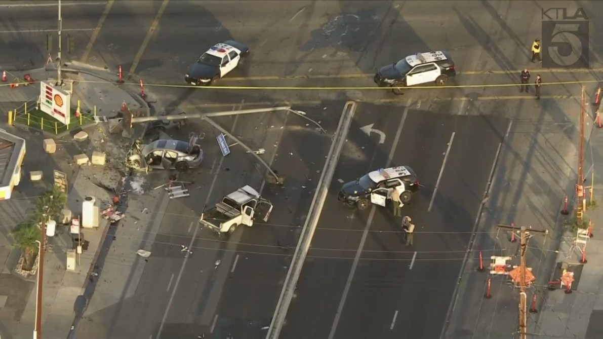 Three people were hospitalized after a pursuit ended with a destructive crash in Long Beach on Nov. 24, 2023. (KTLA)