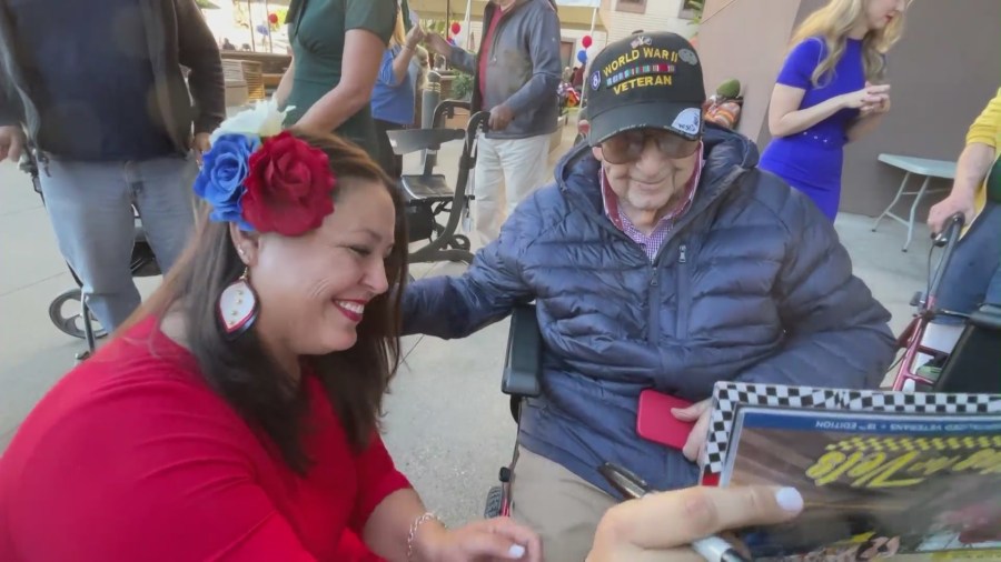 A group of female veterans with Pin-Ups for Vets, dressed up as WWII-style pin-up models while giving back to the community on Veteran’s Day on Nov. 11, 2023. (KTLA)