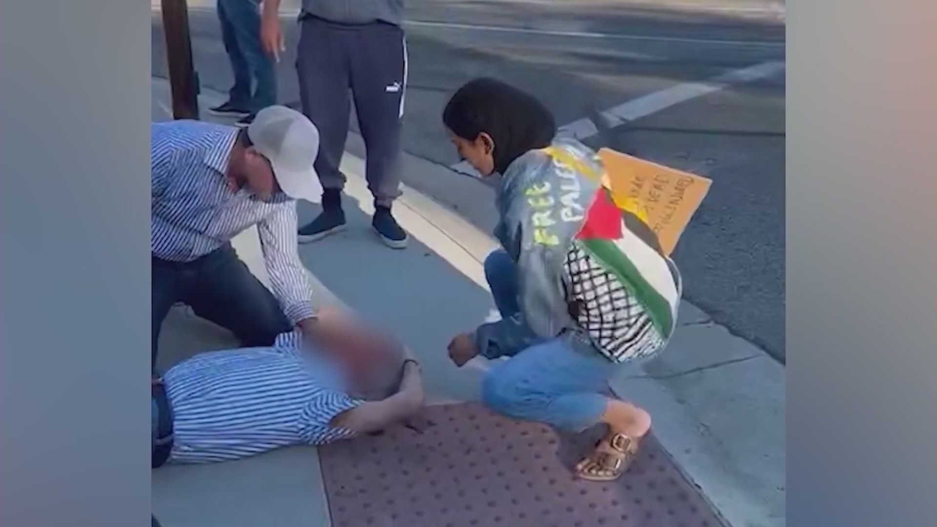 Video posted to social media shows an elderly man lying on the ground after purportedly being struck with a megaphone at a pro-Palestinian rally in Thousand Oaks, California. Nov., 5, 2023.