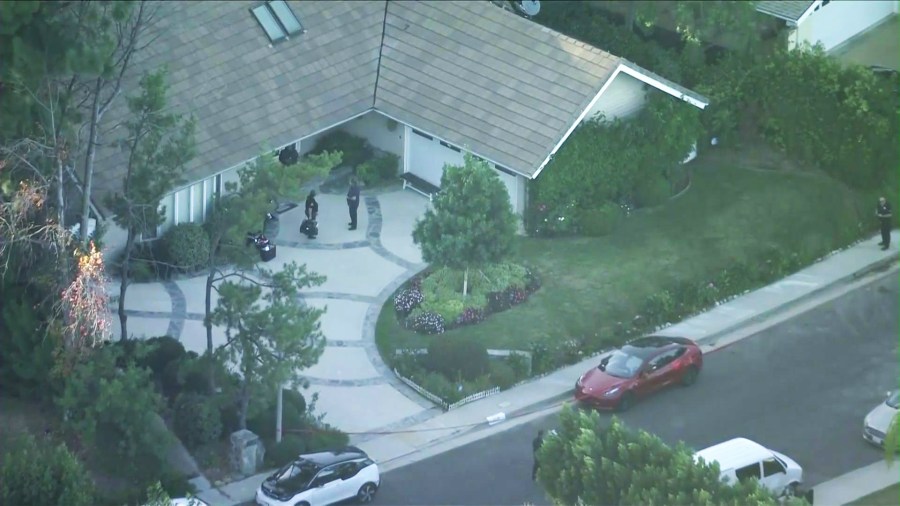 Detectives are seen at the Haskell Family's home on Coldstream Terrace in Tarzana on Nov. 8, 2023. (KTLA)