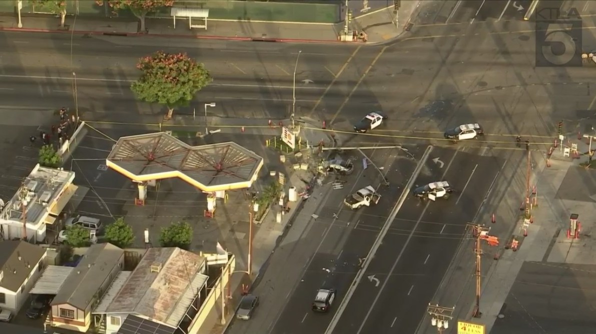 Three people were hospitalized after a pursuit ended with a destructive crash in Long Beach on Nov. 24, 2023. (KTLA)