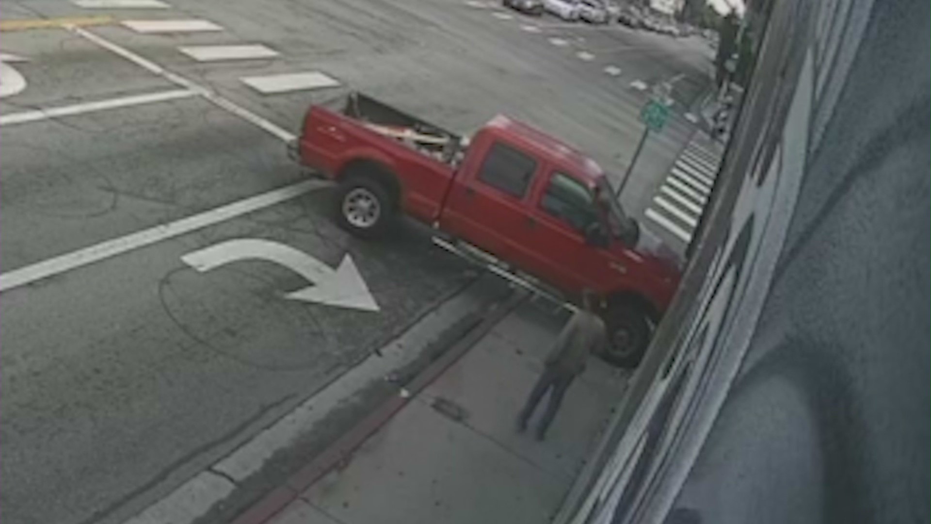 Surveillance video captures the frightening moment a pickup truck crashes through a West Hollywood barber shop, narrowly missing customers inside on Nov. 16, 2023. (Trendsetters Barbershop)