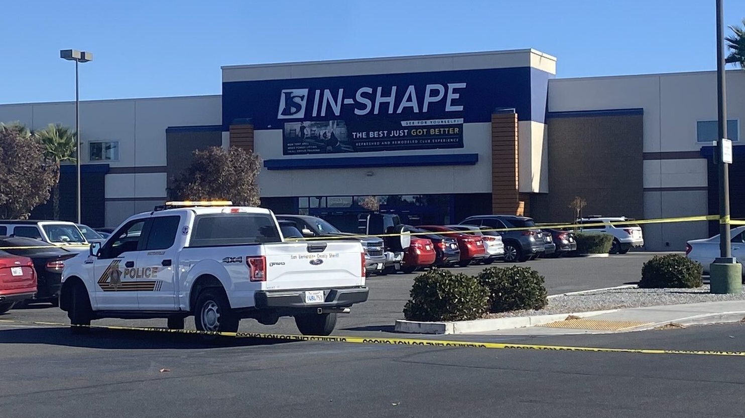 Law enforcement vehicles block off the parking lot of a gym in Victorville where a shooting involving a deputy took place on Nov. 9, 2023. (Shelby Nelson/KTLA)