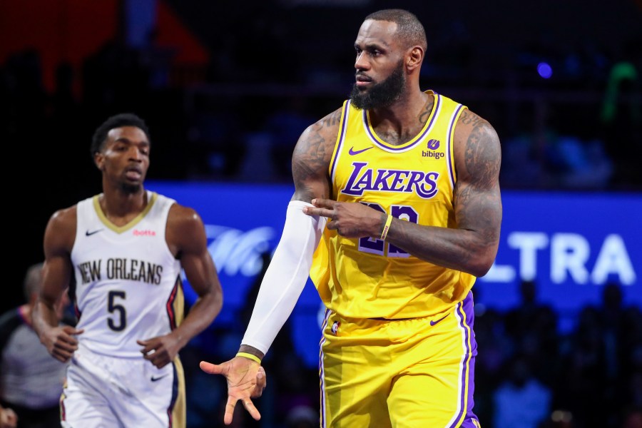 Los Angeles Lakers forward LeBron James (23) celebrates after making a 3-point basket against the New Orleans Pelicans during the first half of a semifinal in the NBA basketball In-Season Tournament, Thursday, Dec. 7, 2023, in Las Vegas. (AP Photo/Ian Maule)