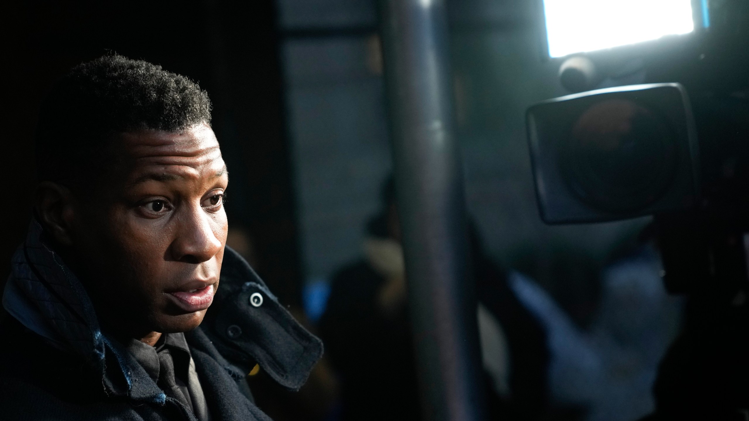 Jonathan Majors leaves a courtroom in New York, Monday, Dec. 18, 2023. Majors was convicted of assaulting his former girlfriend during a confrontation in New York City earlier this year. A Manhattan jury convicted the Marvel star Monday of one misdemeanor assault charge and one harassment violation. (AP Photo/Seth Wenig)