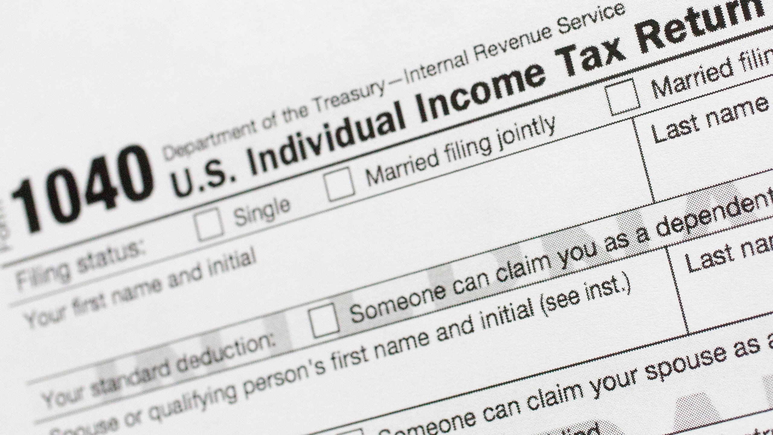 FILE - Part of a 1040 U.S. Individual Income Tax Return form is shown July 24, 2018, in New York. Only 11% of Americans itemize their taxes, which allows them to claim significant tax deductions for charitable donations. (AP Photo/Mark Lennihan, File)