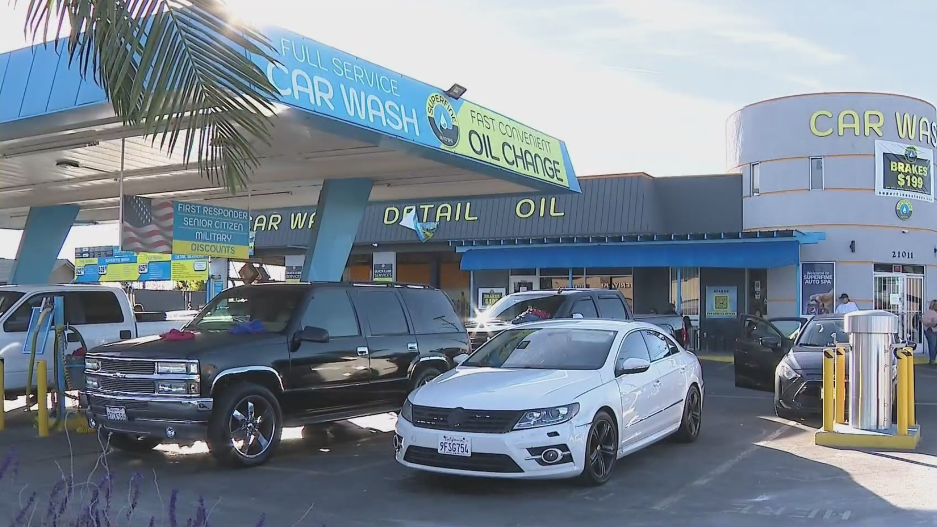 Outside the car wash where a school crossing guard who was thrown into the air after a vehicle jumped the curb and smashed into him in Lakewood on Dec. 1, 2023. (KTLA)