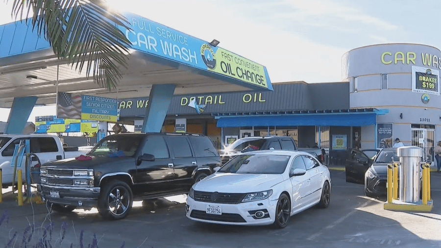 Outside the car wash where a school crossing guard who was thrown into the air after a vehicle jumped the curb and smashed into him in Lakewood on Dec. 1, 2023. (KTLA)