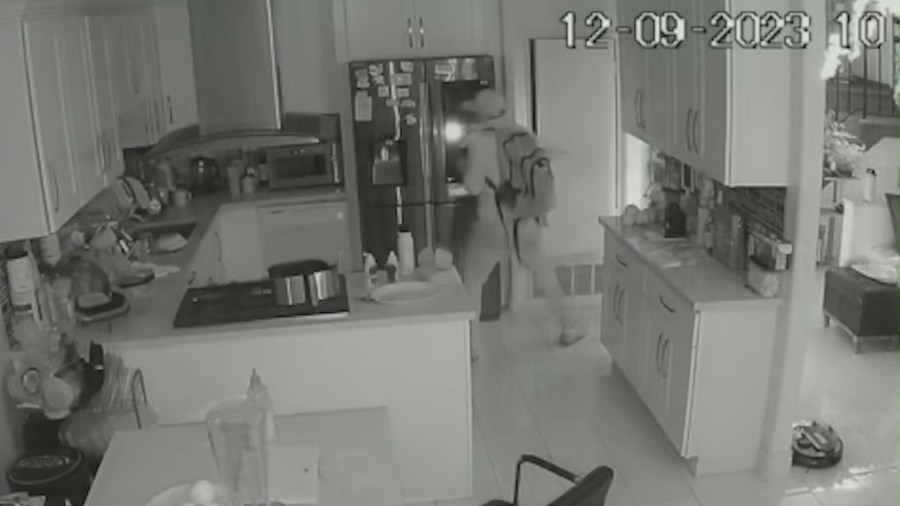 Security video captures the moment a burglar broke into a home and stole thousands of dollars worth of cash and jewelry in Westminster on Dec. 9, 2023. (Le Family)