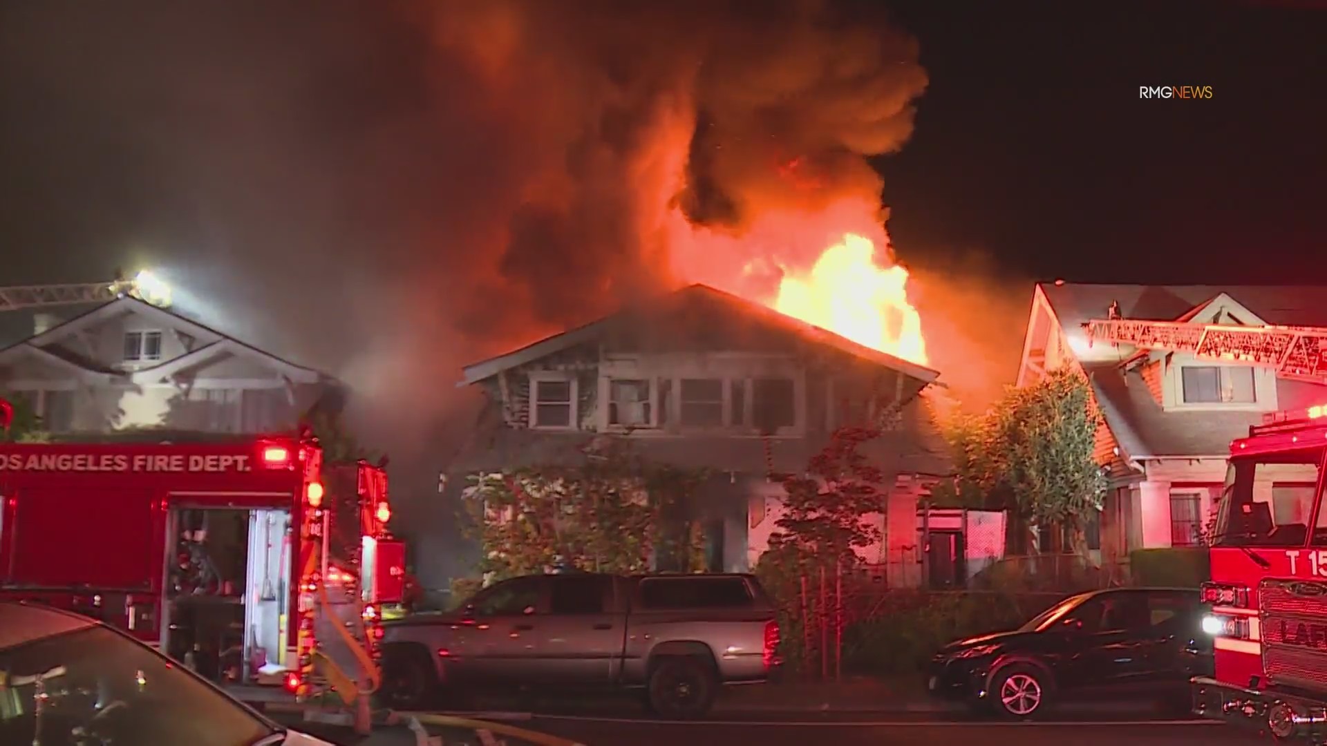 Video: Fire crews scramble to safety as fireball bursts through roof of home