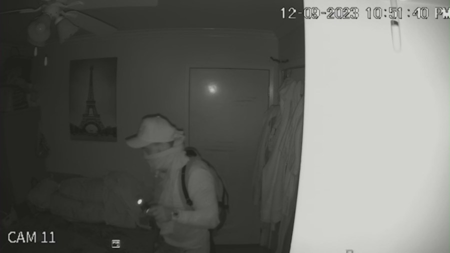 Security video captures the moment a burglar broke into a home and stole thousands of dollars worth of cash and jewelry in Westminster on Dec. 9, 2023. (Le Family)