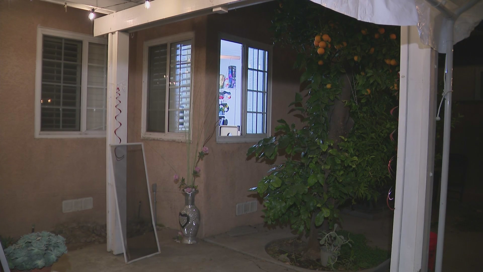 The window through where an intruder broke into a Norwalk home before being chased with a hammer by the homeowner on Dec. 7, 2023. (KTLA)