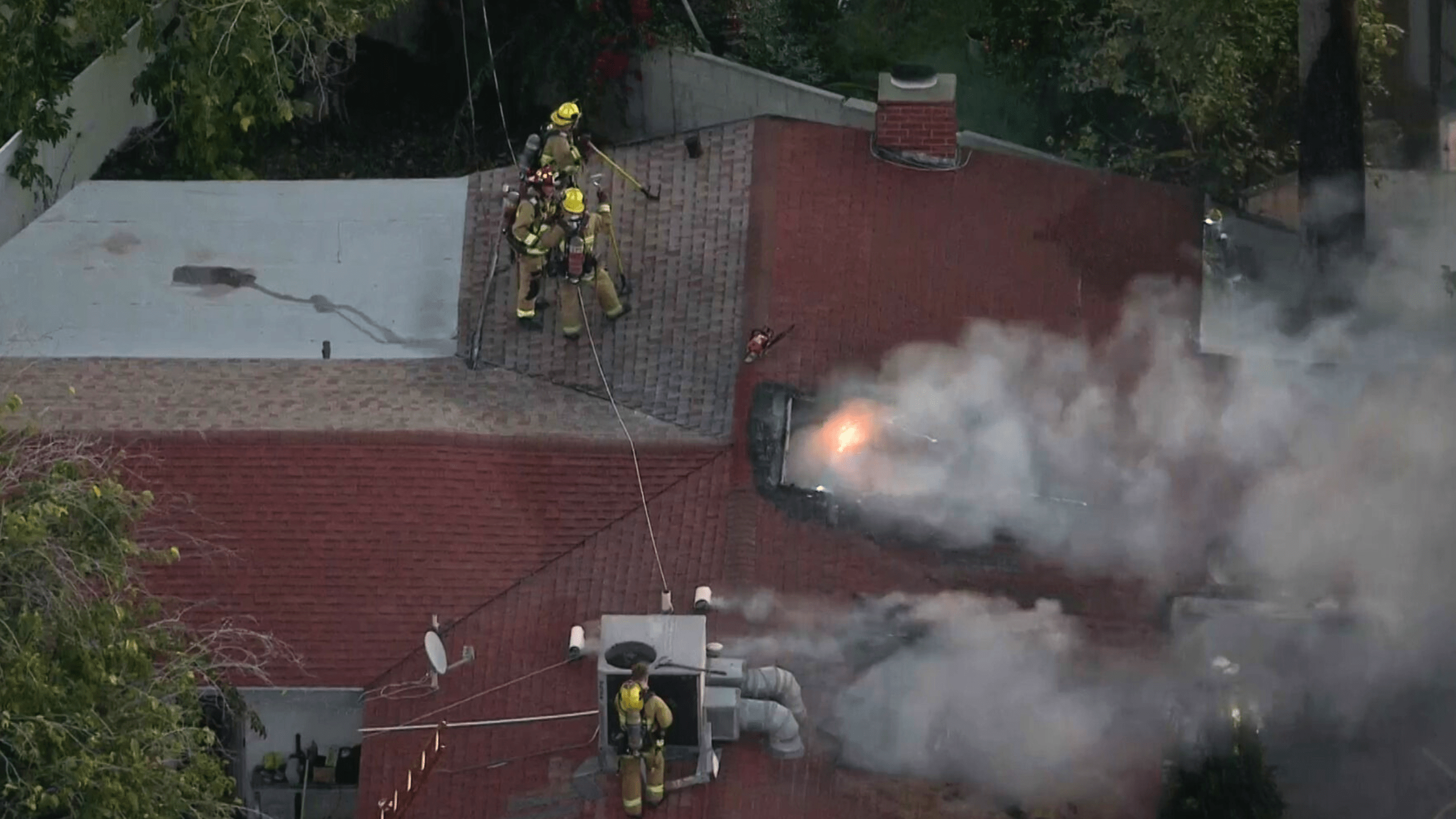 Crews battle a house fire in Reseda on Jan. 8, 2024.